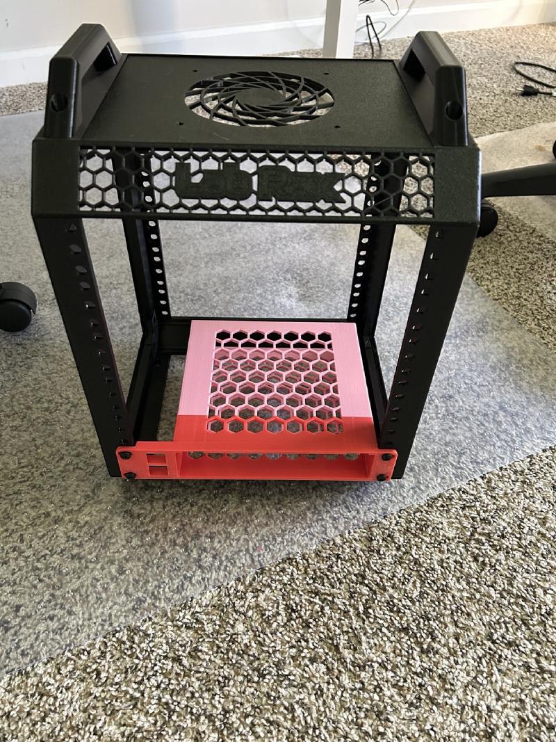 Labrax frame with its open mounting rails, ventilated top panel and circular fan opening