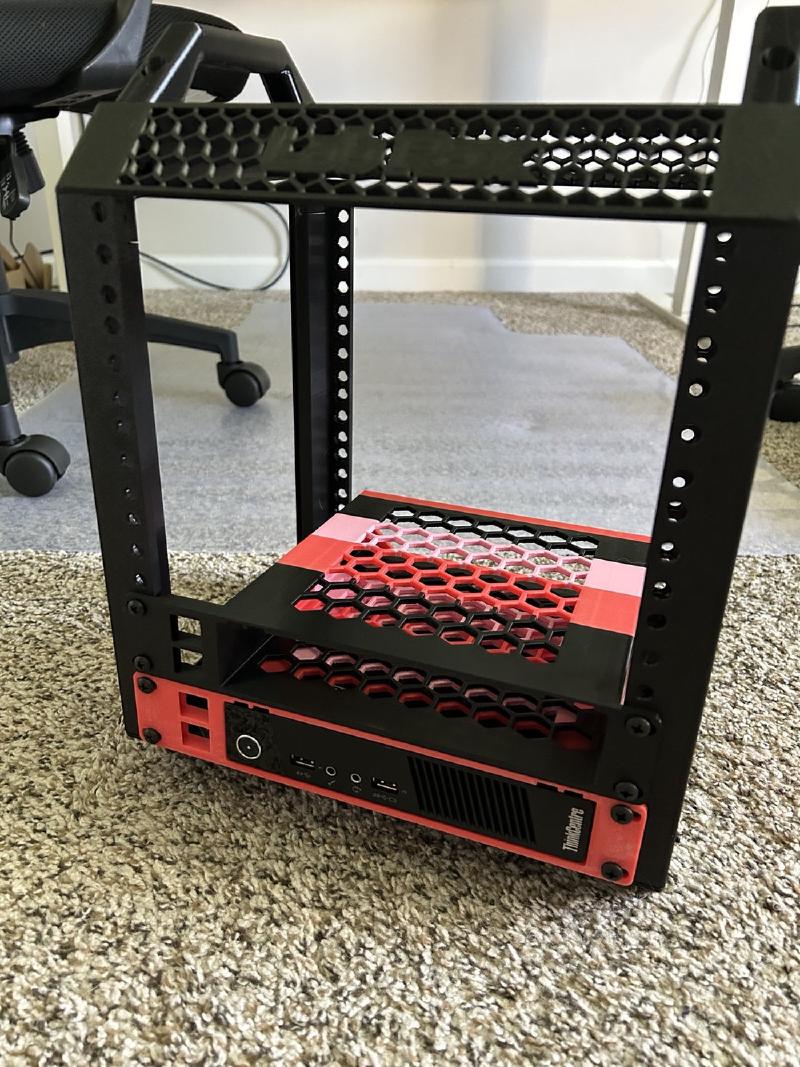 Lenovo ThinkCentre Tiny mounted in the bottom of the Labrax rack with a red printed front bracket